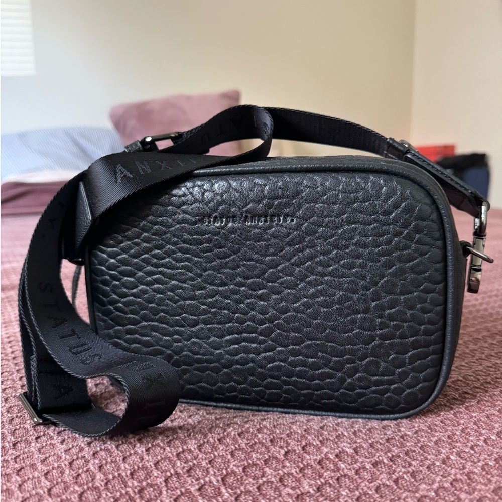 Status Anxiety plunder leather crossbody bag